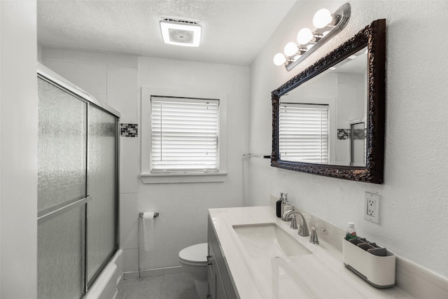 5808 Community Dr, Houston, TX 77005 - full bathroom with vanity, toilet, a textured wall, a textured ceiling, and combined bath / shower with glass door