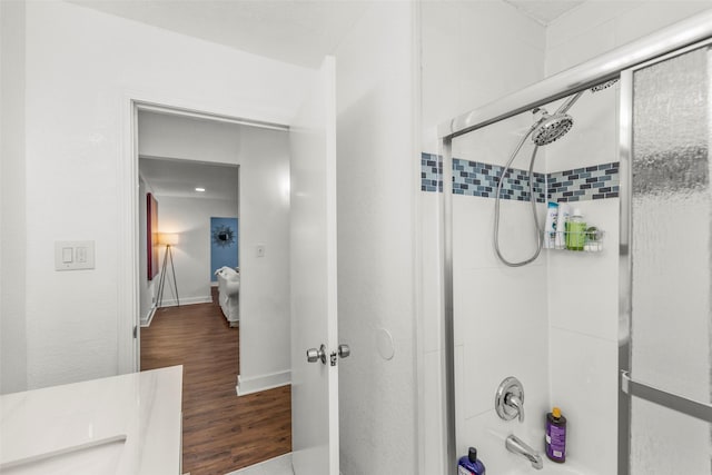 5808 Community Dr, Houston, TX 77005 - full bath with shower / washtub combination, baseboards, and wood finished floors