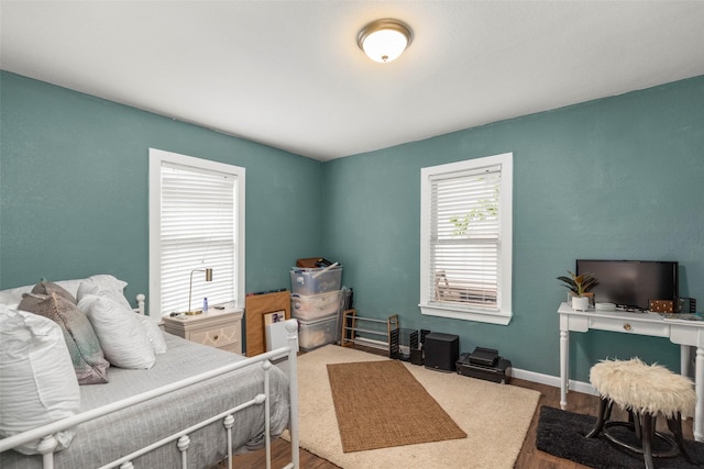 5808 Community Dr, Houston, TX 77005 - bedroom with baseboards and wood finished floors