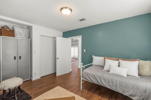 5808 Community Dr, Houston, TX 77005 - bedroom featuring wood finished floors, a closet, baseboards, and visible vents