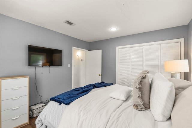 5808 Community Dr, Houston, TX 77005 - bedroom featuring visible vents, a closet, and wood finished floors