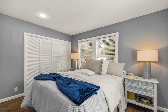 5808 Community Dr, Houston, TX 77005 - bedroom with baseboards, a closet, and wood finished floors