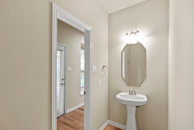155 Pronghorn Pl, Montgomery, TX 77316 - bathroom featuring baseboards and wood finished floors