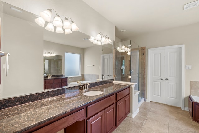 155 Pronghorn Pl, Montgomery, TX 77316 - bathroom with a stall shower, visible vents, a garden tub, and a chandelier
