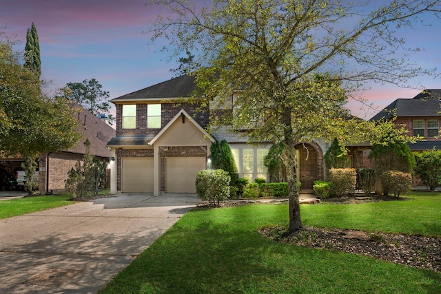 155 Pronghorn Pl, Montgomery, TX 77316 - view of front of home with a front lawn, an attached garage, brick siding, and concrete driveway