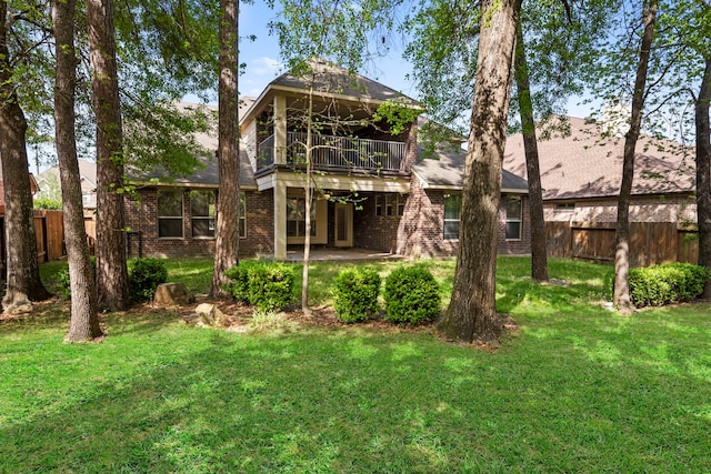 155 Pronghorn Pl, Montgomery, TX 77316 - back of house featuring a balcony, a patio, fence, and a yard
