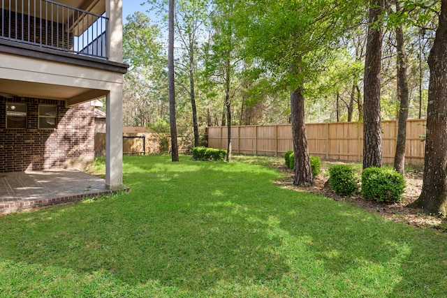 155 Pronghorn Pl, Montgomery, TX 77316 - view of yard featuring a balcony, fence, and a patio