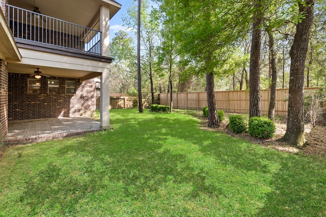 155 Pronghorn Pl, Montgomery, TX 77316 - view of yard featuring a balcony, fence, and a patio
