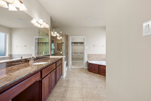 155 Pronghorn Pl, Montgomery, TX 77316 - full bathroom featuring a bath, visible vents, tile patterned floors, a stall shower, and a walk in closet