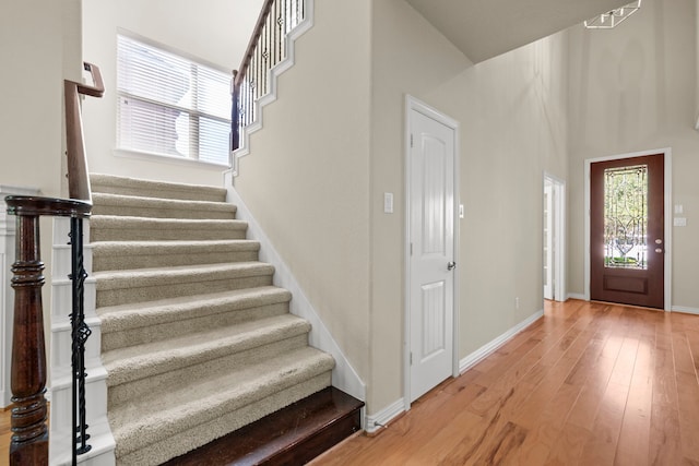 155 Pronghorn Pl, Montgomery, TX 77316 - entrance foyer featuring baseboards, light wood-style floors, and stairs