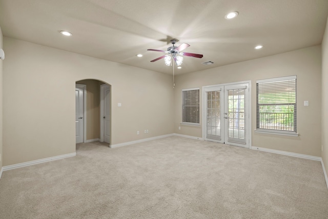 155 Pronghorn Pl, Montgomery, TX 77316 - spare room with recessed lighting, baseboards, arched walkways, ceiling fan, and light carpet