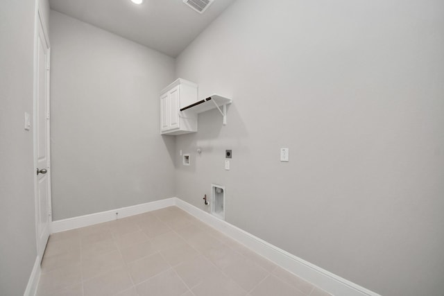 clothes washing area featuring gas dryer hookup, baseboards, cabinet space, electric dryer hookup, and washer hookup