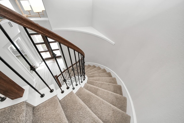 staircase with a high ceiling