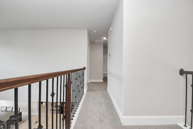 10015 Crescent Wood Dr, Missouri City, TX 77459 - corridor featuring baseboards, an upstairs landing, and carpet flooring