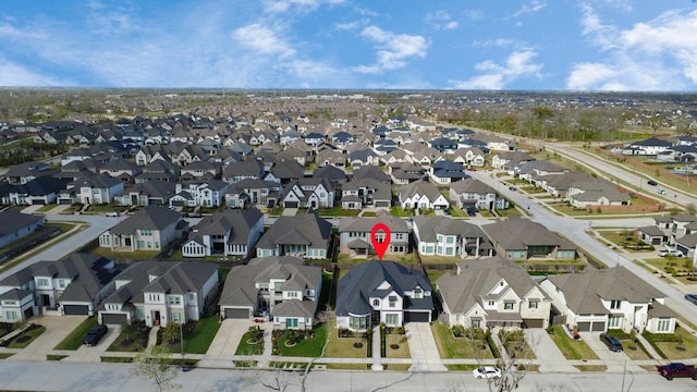 birds eye view of property with a residential view