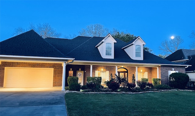 4818 Mckeever Ln, Missouri City, TX 77459 - new england style home with brick siding, a front lawn, an attached garage, and driveway