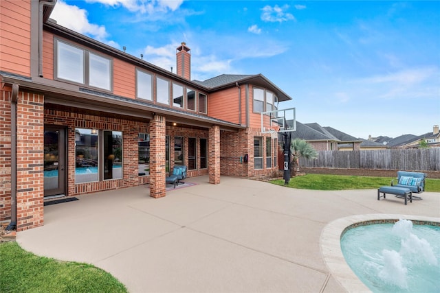 view of pool with a yard, fence, and a patio