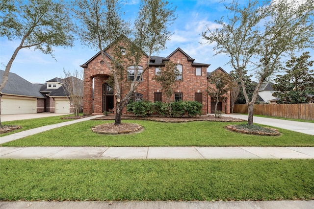 view of front of house with fence, an attached garage, brick siding, and concrete driveway