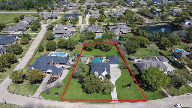 17310 Calico Peak Way, Cypress, TX 77433 - aerial view of residential area with a large body of water and property parcel outlined