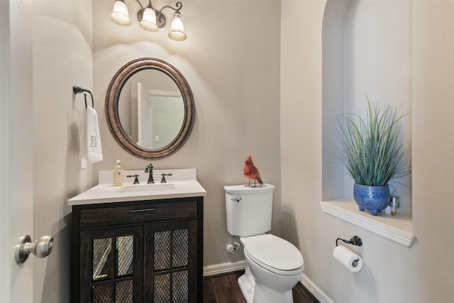 17310 Calico Peak Way, Cypress, TX 77433 - half bath with toilet, wood finished floors, vanity, and baseboards