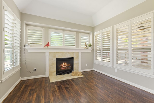 17310 Calico Peak Way, Cypress, TX 77433 - unfurnished living room featuring hardwood / wood-style flooring, a fireplace, healthy amount of natural light, and baseboards