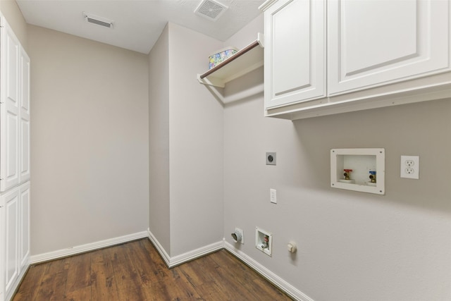 17310 Calico Peak Way, Cypress, TX 77433 - washroom with hookup for an electric dryer, washer hookup, dark wood-type flooring, cabinet space, and hookup for a gas dryer