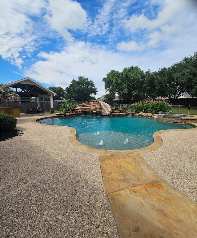 17310 Calico Peak Way, Cypress, TX 77433 - view of pool featuring a fenced backyard, a gazebo, a patio, a pool with connected hot tub, and a water slide