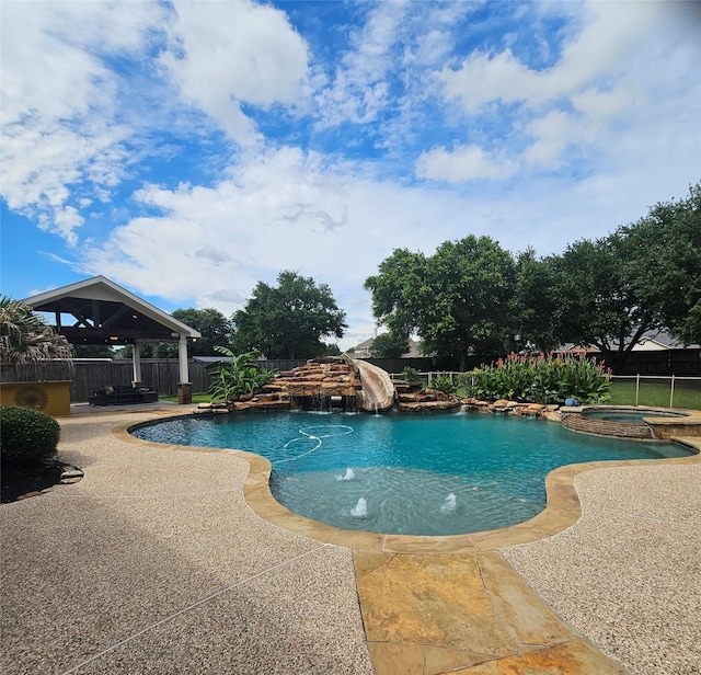 17310 Calico Peak Way, Cypress, TX 77433 - view of pool with a gazebo, a fenced backyard, a pool with connected hot tub, and a patio area