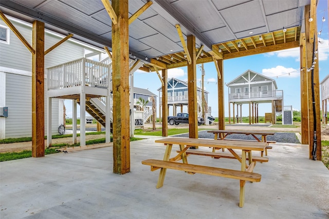 1079 Johnson Rd, Gilchrist, TX 77617 - view of patio featuring stairs and a residential view