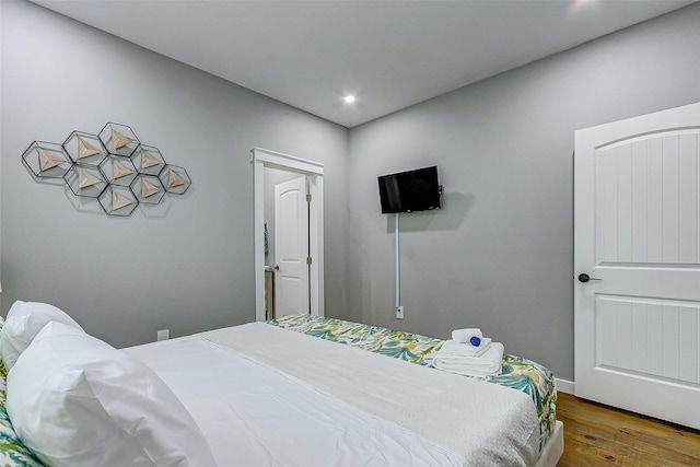 1079 Johnson Rd, Gilchrist, TX 77617 - bedroom with wood finished floors and recessed lighting