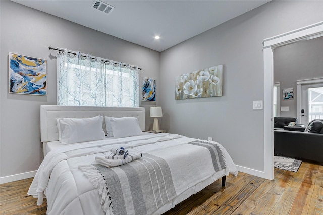 1079 Johnson Rd, Gilchrist, TX 77617 - bedroom featuring wood finished floors and baseboards