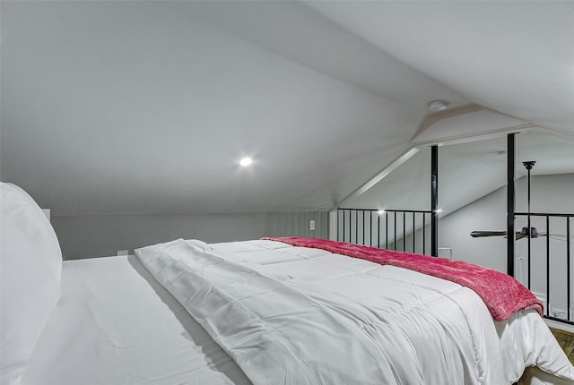 1079 Johnson Rd, Gilchrist, TX 77617 - bedroom with vaulted ceiling and wood finished floors