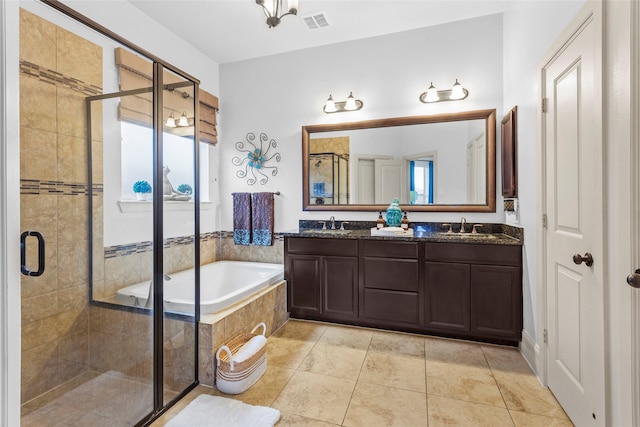 bathroom with a stall shower, a sink, a garden tub, visible vents, and double vanity