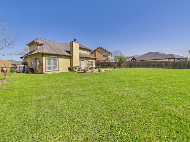 13523 Pasa Robles Ln, Houston, TX 77083 - view of yard with a fenced backyard, a patio area, and central AC