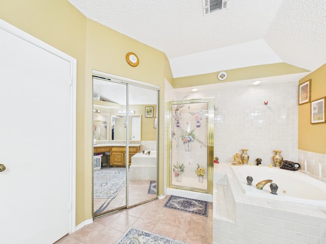 13523 Pasa Robles Ln, Houston, TX 77083 - bathroom featuring a shower stall, a textured ceiling, visible vents, and a garden tub