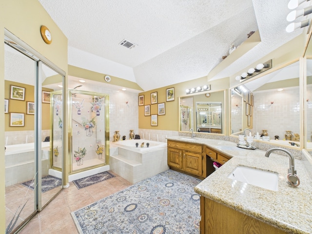 13523 Pasa Robles Ln, Houston, TX 77083 - bathroom with a textured ceiling, visible vents, a sink, and a bath
