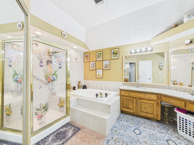 13523 Pasa Robles Ln, Houston, TX 77083 - full bath with tile patterned floors, vanity, a garden tub, a textured ceiling, and visible vents