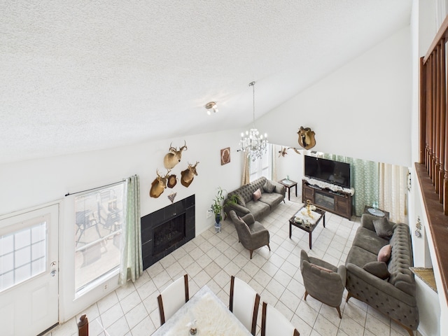 13523 Pasa Robles Ln, Houston, TX 77083 - tiled living area with a textured ceiling, plenty of natural light, a fireplace, lofted ceiling, and a notable chandelier