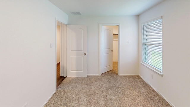 24327 Copperleaf Bay Ln, Spring, TX 77373 - unfurnished bedroom featuring light colored carpet and baseboards