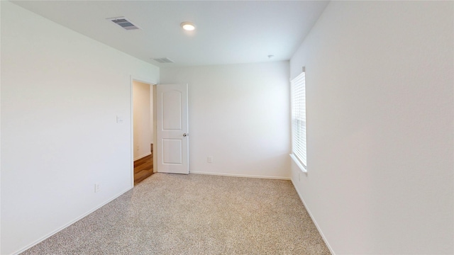 24327 Copperleaf Bay Ln, Spring, TX 77373 - empty room with healthy amount of natural light, light colored carpet, and baseboards