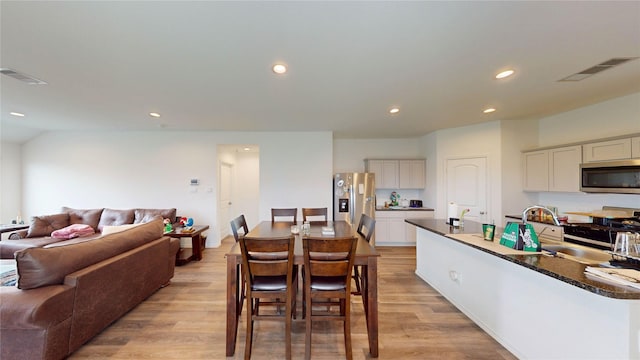 24327 Copperleaf Bay Ln, Spring, TX 77373 - dining room featuring light wood-style floors and recessed lighting