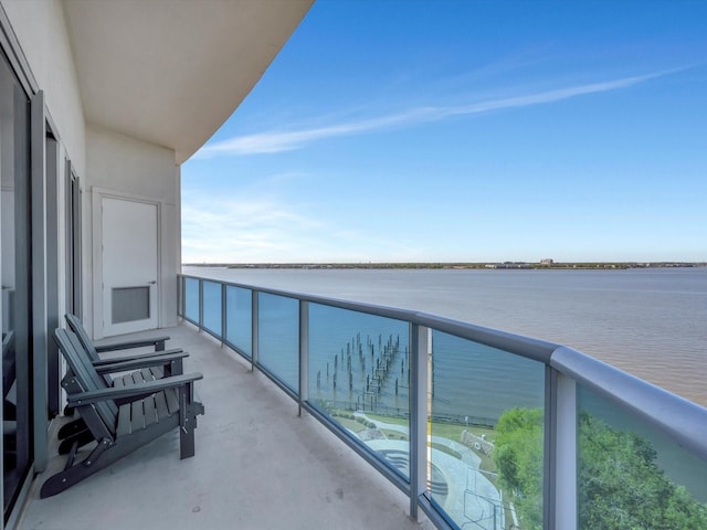 balcony featuring a water view