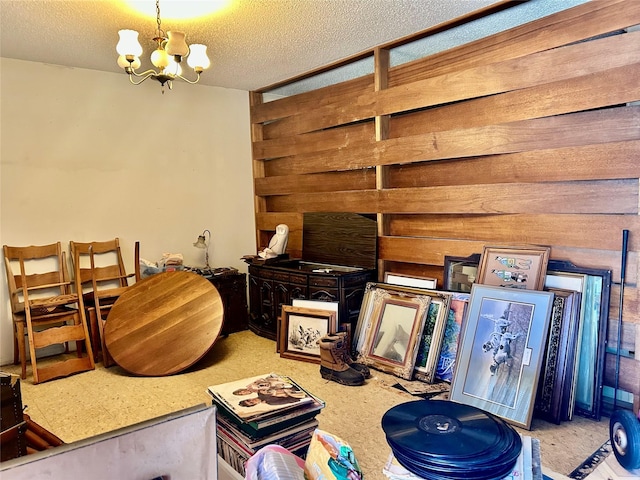 325 Hargett St, Clute, TX 77531 - miscellaneous room featuring a chandelier and a textured ceiling