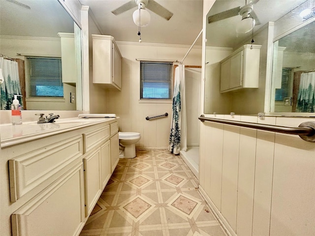 325 Hargett St, Clute, TX 77531 - full bathroom with ceiling fan, toilet, vanity, curtained shower, and ornamental molding