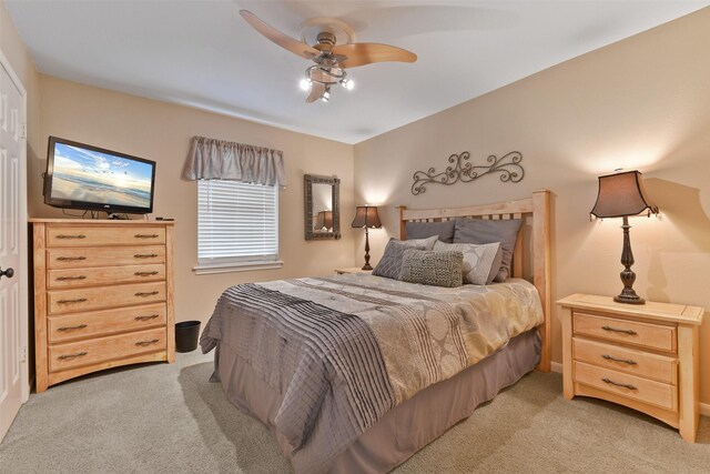 2536 22nd Ave N, Texas City, TX 77590 - bedroom with a ceiling fan and light carpet