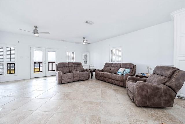 living room featuring visible vents, light tile patterned floors, french doors, and a ceiling fan