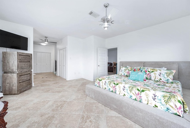 bedroom featuring ceiling fan and visible vents