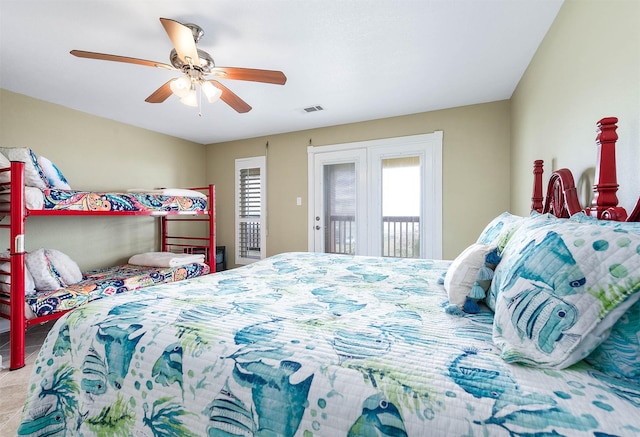 bedroom featuring access to exterior, visible vents, multiple windows, and a ceiling fan