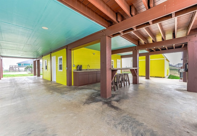 view of patio with a sink and outdoor dry bar