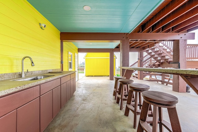 view of patio featuring a sink and stairway